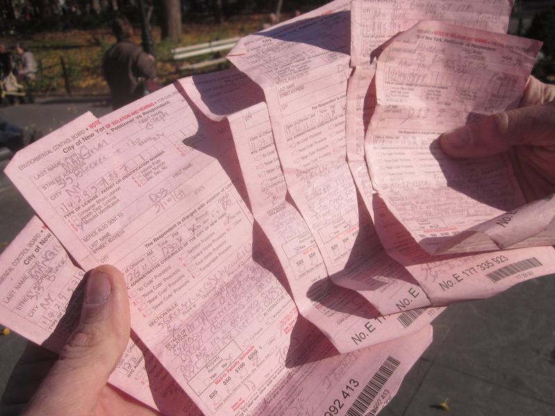 The stack of summonses recently received by artist Joe Mangrum